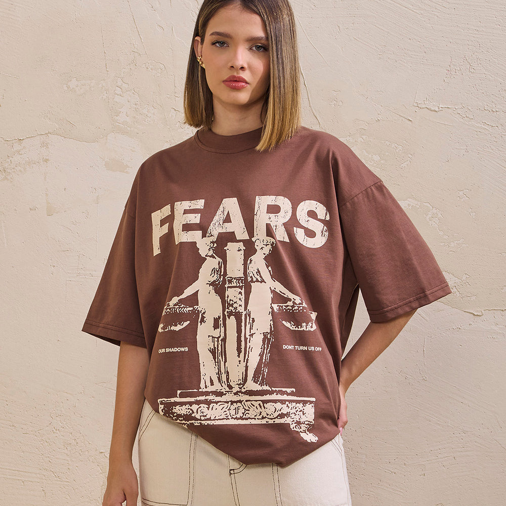 
                      
                        Camiseta oversized our shadows- café
                      
                    